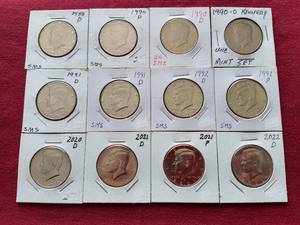 lot 1 image: (12) Kennedy Half Dollars in Flips - Mostly Uncirculated