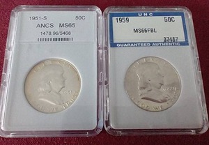 lot 89 image: (2) Slabbed Franklin Half Dollars