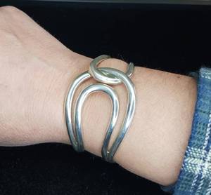 lot 8 image: Sterling Silver cuff bracelet, knot design. Kit Heath makers mark