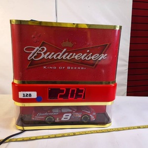 lot 128 image: Budweiser Dale Earnhardt Jr. Racing Showcase Clock, which is a collectible light-up advertising display featuring a #8 car model.