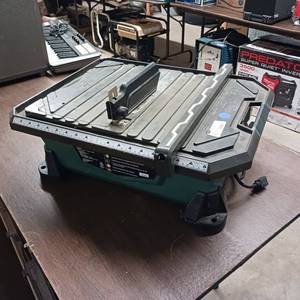 lot 153 image: Masterforce 7-inch wet tile saw - 58 arbor - diamond-coated blade and a water cooling system