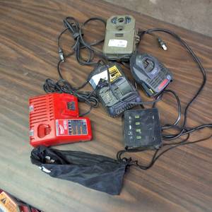 lot 319 image: Milwaukee M18 & M12 Multi-Voltage Charger (Model 48-59-1812).  and other chargers plus a trail cam