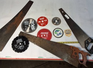 lot 321 image: A collection of cutting tools, primarily circular saw blades for power saws and traditional hand saws.