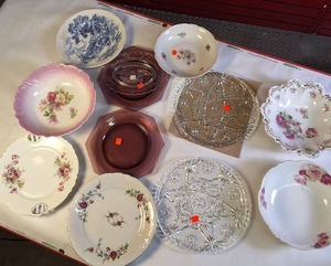 lot 334 image: Collection of vintage porcelain and glass dishes, featuring various floral patterns, gilded rims, and crystal designs.
