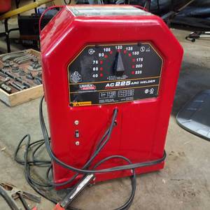 lot 387 image: Lincoln Electric AC-225 arc welder, often referred to as a tombstone welder.