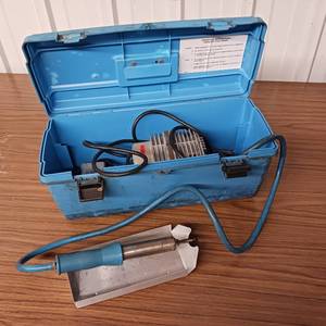 lot 203 image: Seelye Model 63 Porta-Welder thermoplastic welder kit, which includes a carrying case, heating element, and tray