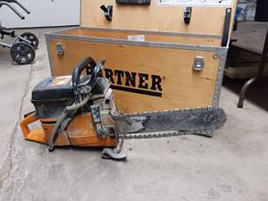 lot 89 image: Partner K950 Active Concrete Chain Saw used for cutting hard materials like concrete, stone, and pipe - works great with case