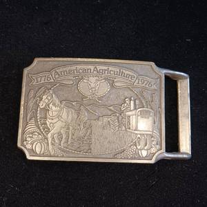 lot 299 image: American Agriculture Bicentennial buckle -1975, 200th anniversary of farming in America - Ortho Chevron Chemical Company.