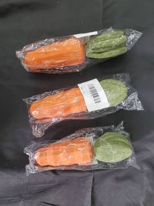 lot 108 image: Carrot-Shaped Plastic Toys - 3-Pack Orange with Green Tops, Made in China