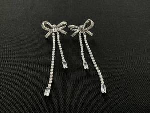 lot 14 image: HEYMAEVE CUBIC ZIRCONIA 18K GOLD PLATED SILVER BOW LINEAR DROP EARRINGS 2