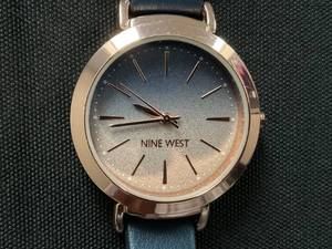 lot 150 image: Nine West Womens Quartz Navy Faux Leather Band Watch, 36mm (Slightly Used, Needs Battery, Minor Scratches)