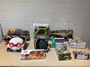 lot 159 image: LOT OF 10 Interactive Toys Jurrassic World, Ninja Turtles, Robo Alive, How To Train Your Dragon, Dino Crunch, Robo-X, Tech Deck