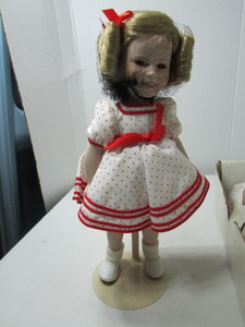 lot 66 image: Vintage Shirley Temple Porcelain Doll