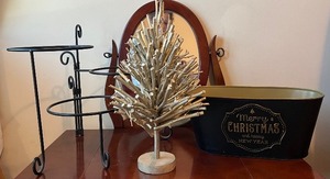 lot 24 image: Holiday Decor and Home Accessory Lot with Tiered Metal Stand, Christmas Tree, Basket, and Planter