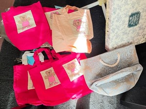 lot 112 image: Collection of Tote Bags with Bear Patch Designs and Blue Patterned Bag