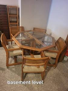 lot 6 image: Octagonal Glass Top Dining Table with 6 Wood and Rattan Chairs