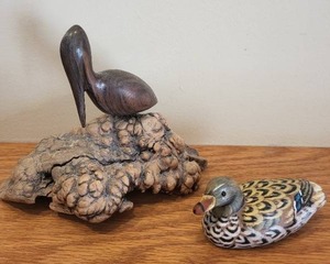 lot 164 image: Set of 2 Handcrafted Bird Figurines - Duck and Pelican on Burl Wood
