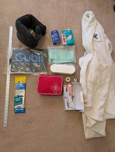 lot 73 image: Wellness and Comfort Lot with Robe, Travel Pillow, First Aid Kit, and Accessories