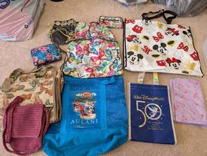 lot 83 image: Collection of Tote Bags, Rolling Carrier, Disney Bags and The Sak Crochet Purse