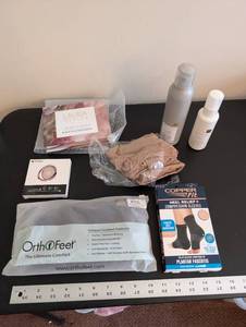 lot 255 image: Personal Care and Accessories Bundle with Footwear Supports, Cosmetics, and Phone Holder