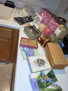 lot 270 image: Decorative Home Decor Assortment Including Carved Wooden Box, Aynsley Clock, Candles, and Collectibles