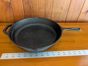 lot 105 image: Lodge Cast Iron Skillet with Helper Handle - Made in USA