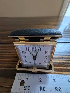 lot 160 image: Elgin Travel Alarm Clock - Gold Tone Square with Leatherette Case
