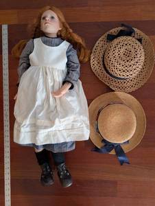 lot 193 image: Doll With White Pinafore Dress And Two Straw Hats