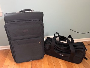 lot 25 image: Black 2-Piece Luggage Set - Upright Rolling Suitcase & Duffel Bag