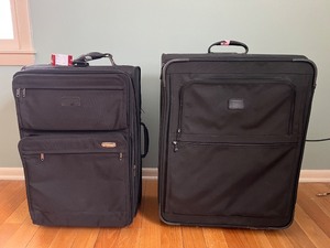 lot 26 image: TravelPro 2-Piece Black Luggage Set - Carry-On & Upright Rolling Suitcases