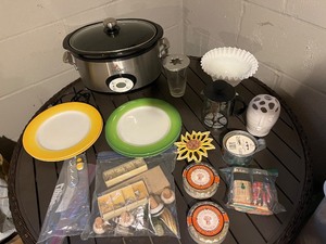 lot 77 image: All-Clad Slow Cooker with Plates, Cupcake Liners, Coffee Carafe & Sunflower Decor