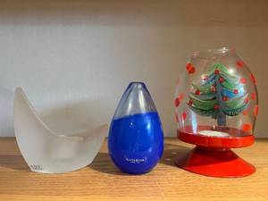 lot 384 image: Kosta Boda Glass Trio Crescent White Sculpture, Blue Teardrop Vessel, Christmas Tree Snow Globe