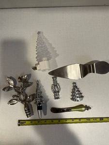 lot 388 image: Silver-Plate Christmas Decor Set Leaf Sprig, Pine Cone Trees, Nutcracker & Cake Knife