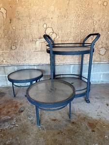 lot 440 image: Blue Metal Glass-Top Patio Table Set - 3-Piece Bar Cart & 2 Round Tables