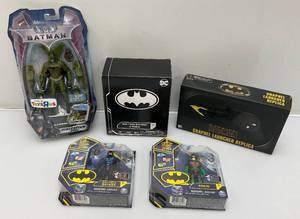 lot 21 image: Misc. BAT-MAN Collectibles Including Grapnel Launcher Replica And More (NIB)