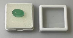 lot 217 image: Light Blue Oval Onyx In Protective Case