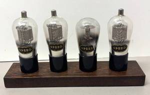 lot 243R image: RR - Vintage Speed Vacuum Tubes Display - 4 Tubes on Wood Base