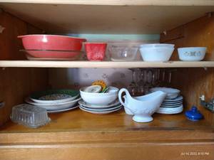 lot 96 image: 2 Shelves Dishes - Some Vintage Pyrex, Federal, Anchor Hocking, Correlle, and Wine Glasses