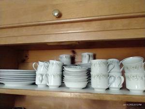 lot 98 image: Shelf of Johann Haviland China - Cups, Saucers, Dinner Plates, Dessert Plates, Sauce Dishes