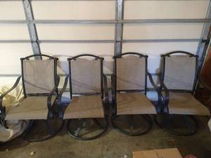 lot 241 image: 4 Brown Swiveling Patio Chairs with Covers
