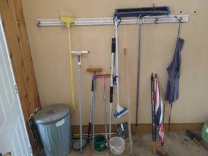 lot 269 image: Hanging Rack with Tools, Metal Garbage Can, & Umbrellas