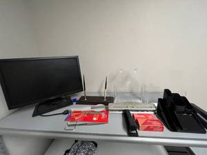 lot 101 image: Office Desk Accessory Lot with Dell Monitor, Organizers, Staplers, and Pens