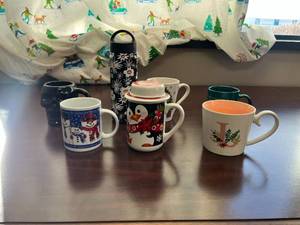 lot 132 image: Collection of 7 Assorted Holiday and Novelty Mugs with Bottle