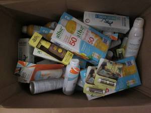 lot 101 image: Large box of assorted sun and skin ...