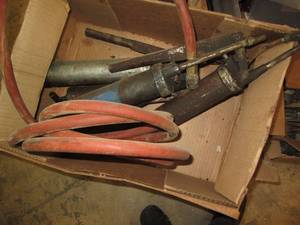 lot 107 image: Grease guns and an air hose...
