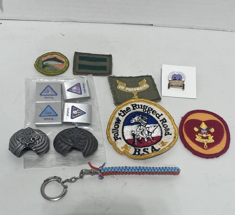 lot 62 image: Lot of Boy Scouts of America Neckerchief Slides, Metal Slides, Patches and Pins
