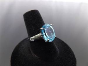 lot 54 image: .925 Sterling Silver Topaz Ring Size 7.25