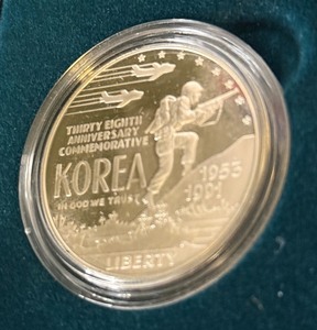 lot 22 image: 1991 Korean War Proof Memorial Dollar Coin - original package with COA, slight damage on box