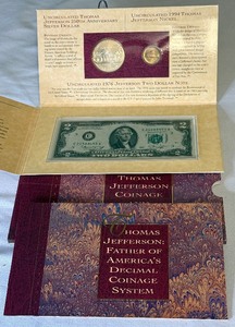 lot 29 image: 1994 Thomas Jefferson Coinage and Currency Set - Uncirculated Silver DollarNickel$2 Bill - original package