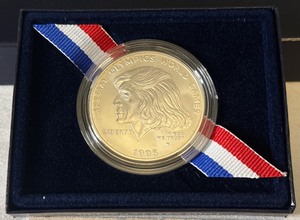 lot 34 image: 1995 W-Special Olympics World Games Uncirculated SILVER Dollar - original package with COA